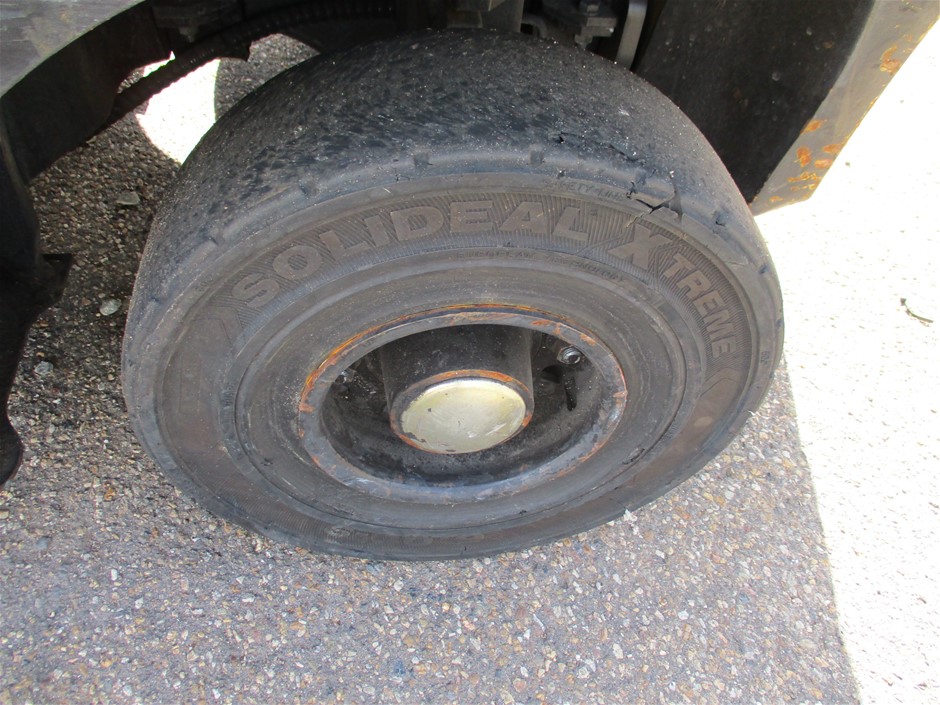 10 carat red ruby rough in glass vial