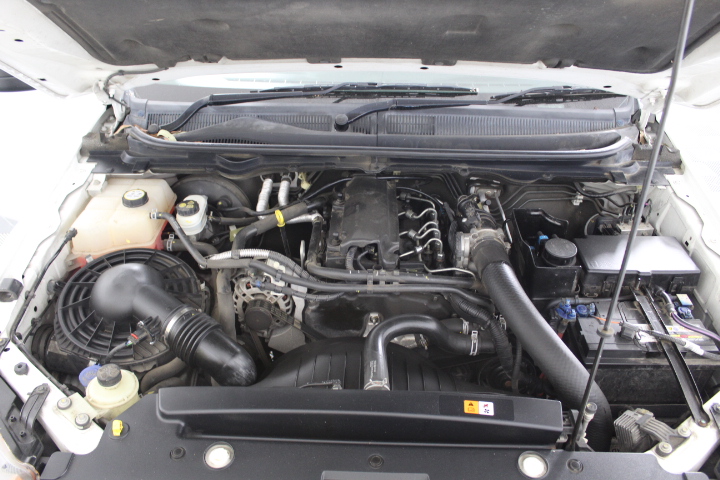 10 carat red ruby rough in glass vial