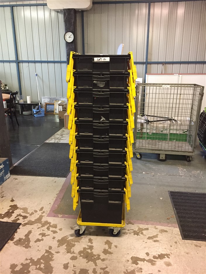 Stack Of 10 Black and Yellow Plastic Crates on Skate With Wheel Locks