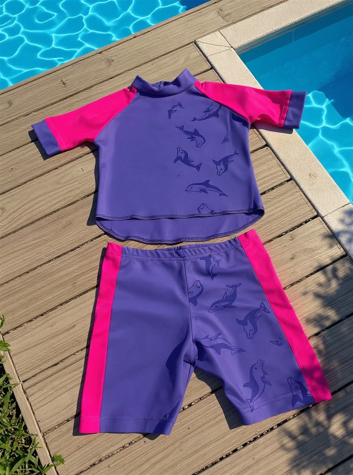 Spliced shorts Made of Water Reactive Fabric Showing Dolphin Print When Wet