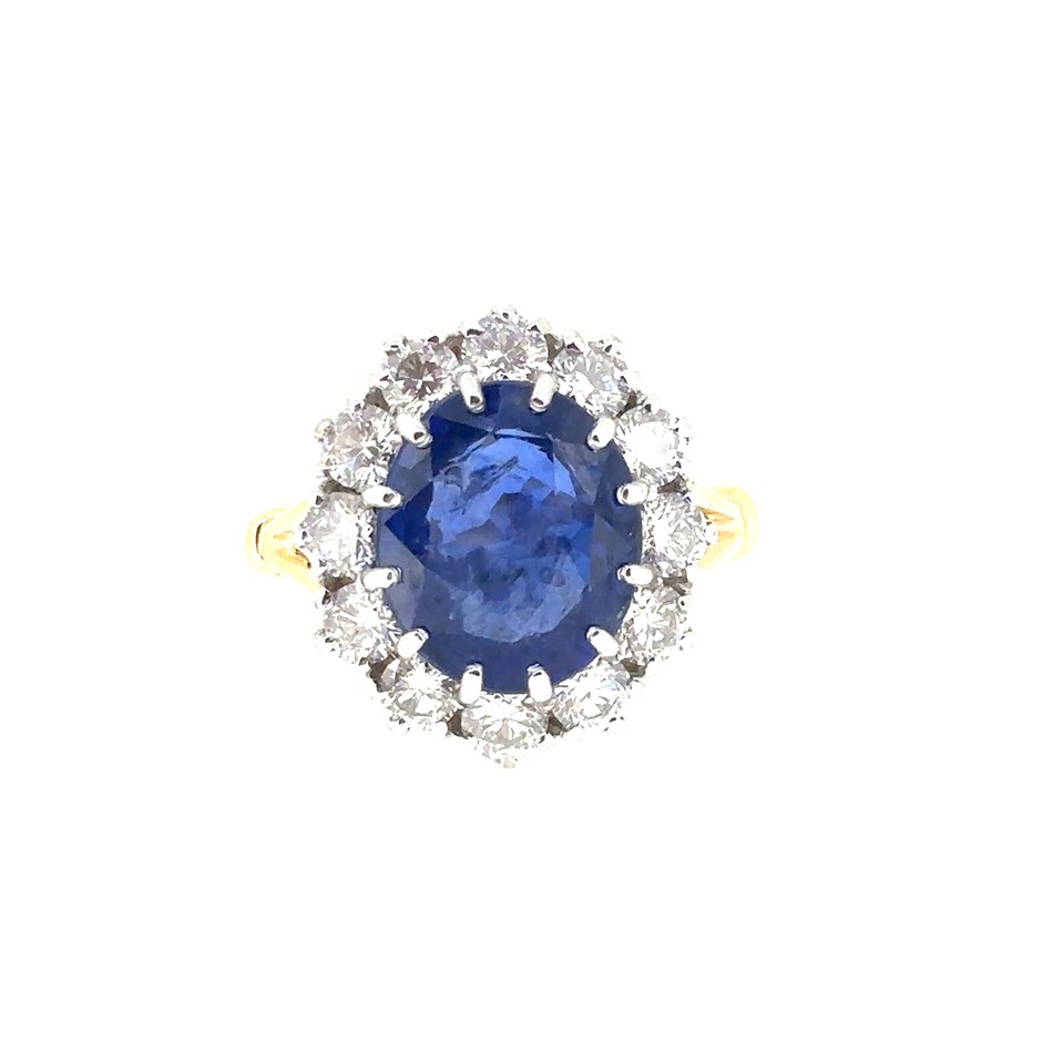 7.16ct Oval Ceylon Blue Sapphire w/ AIG Cert. & 2.05ct 12 Stones F-G/VS Dia