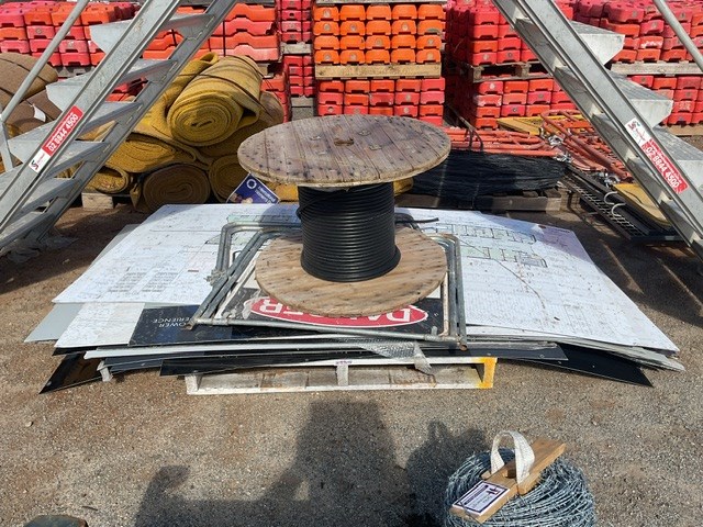 <p>Pallet Of Signs and Part Roll Of Cable</p>