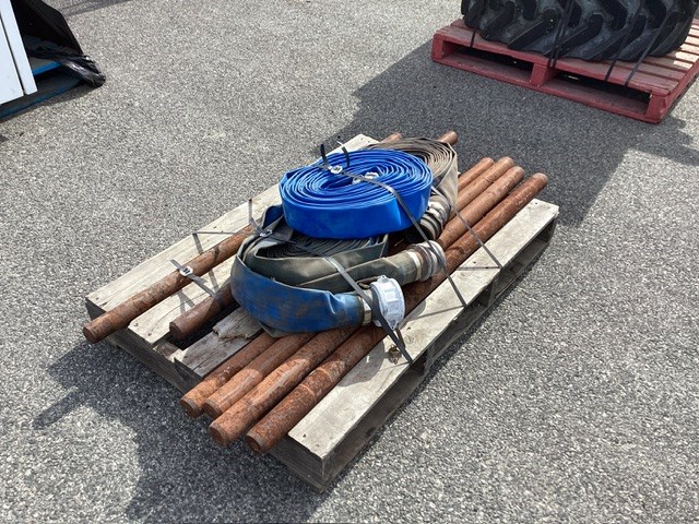 Pallet Containing Flat Hoses And Metal Rods