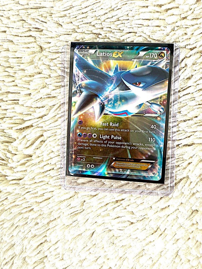 Latios EX holographic dragon-type card.
