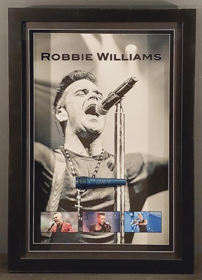 ROBBIE WILLIAMS HANDSIGNED MICROPHONE IN FRAMED DISPLAY