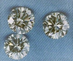 0.03 TCW Light Brown 3 round diamond