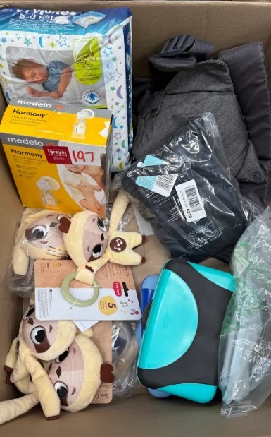 Assorted Box of Baby Items incl: Baby carrier, Medela Breast Pump and more.