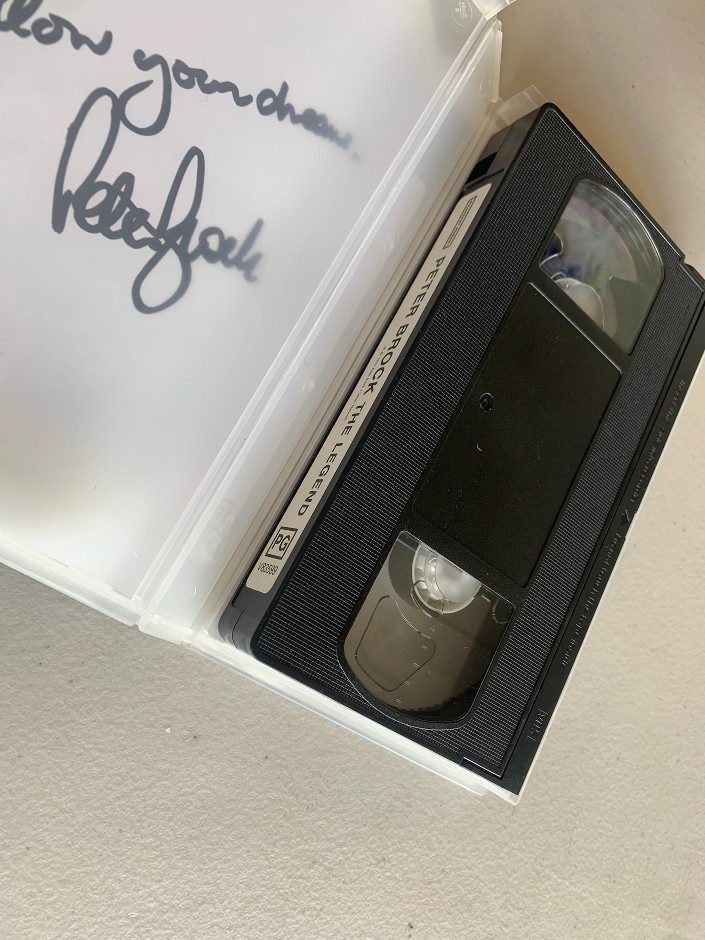 <p>Signed and inscribed original Peter Brock - The Legend VHS tape - CK COA