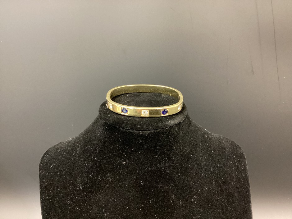 <p>Acid Tested 18ct Yellow Gold, Diamond And Blue Sapphire Bangle</p>