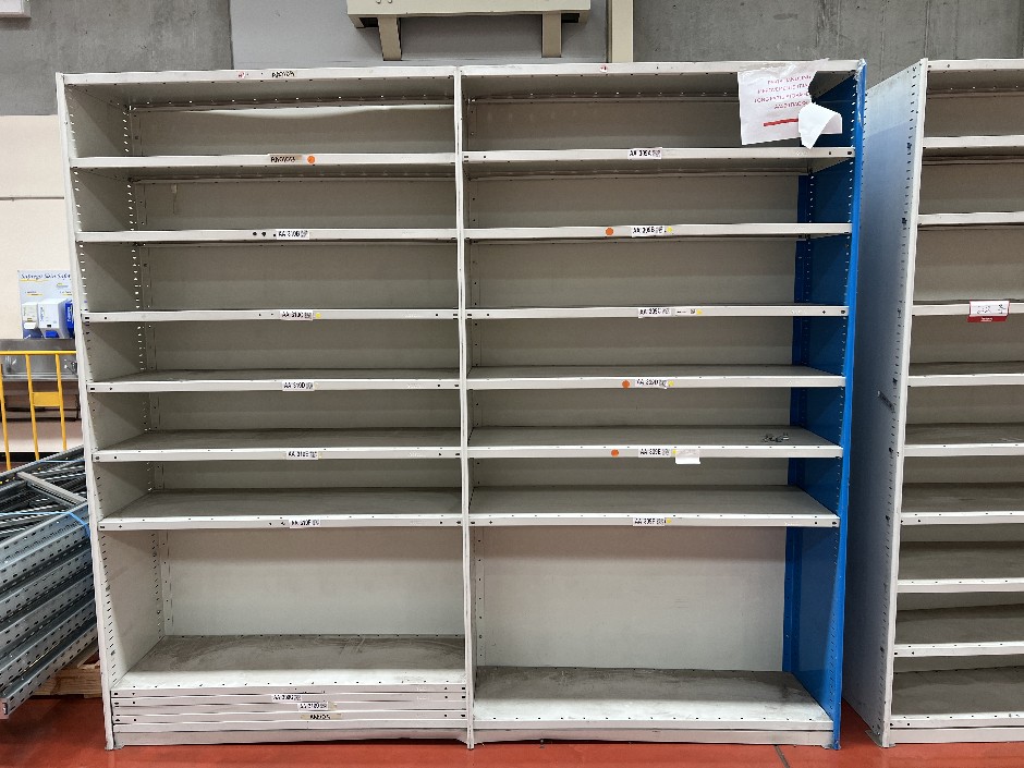 Double-bay metal shelving unit with adjustable shelf heights, double-sided