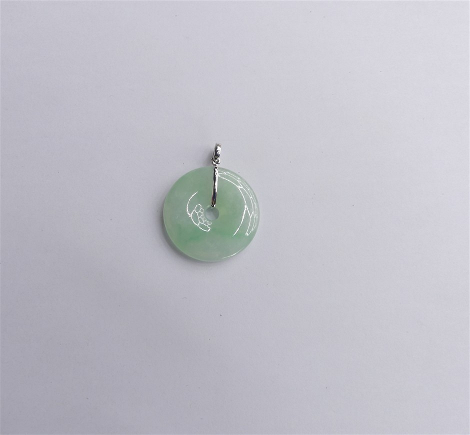 Smooth Light Green Jadeite Donut Pendant With Silver Tone Metal Bale